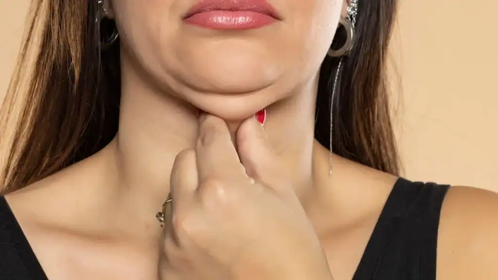 An image of a woman with double chin, sad, worried : Non Surgical Double Chin Removal Treatment in Orrell, UK